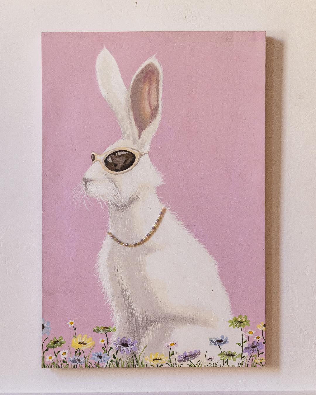 Painting of a white rabbit wearing sunglasses and a pearl necklace, seated among wildflowers against a pink background