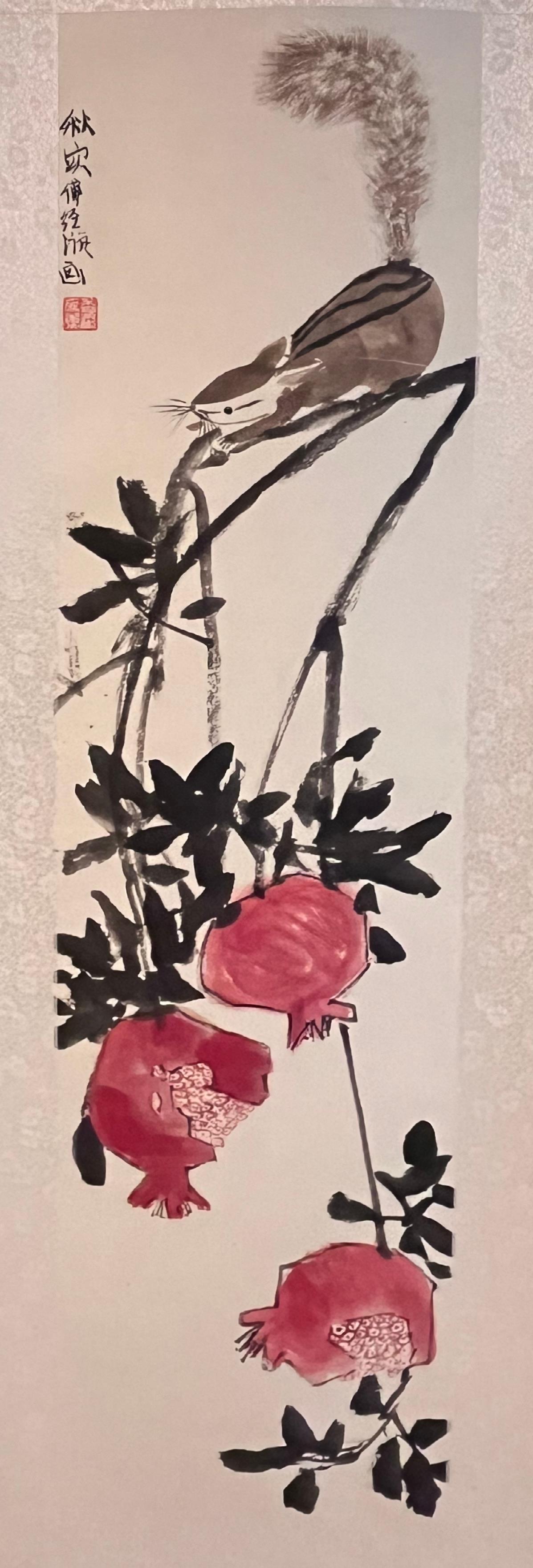 Ink scroll painting of a squirrel perched on a branch above three hanging pomegranates
